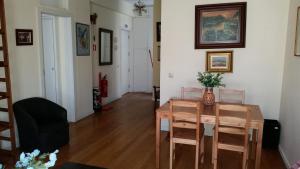 a dining room with a table and chairs at VRS - PORTO BEACH FLAT in Porto