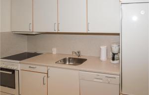 Η κουζίνα ή μικρή κουζίνα στο Apartment Norre Nebel 306
