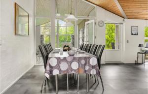 a dining room with a table and chairs at 4 Bedroom Lovely Home In Vestervig in Vestervig
