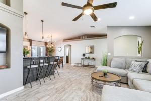a living room with a couch and a ceiling fan at 3 Mi to London Bridge Home with Patio and Grill! in Lake Havasu City