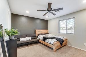 a bedroom with a bed and a couch at 3 Mi to London Bridge Home with Patio and Grill! in Lake Havasu City