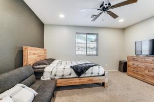 a bedroom with a bed and a couch at 3 Mi to London Bridge Home with Patio and Grill! in Lake Havasu City