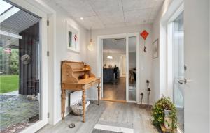 an entrance to a home with a piano at 4 Bedroom Cozy Home In Skjern in Skjern
