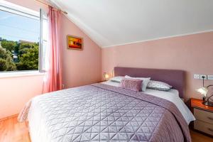 Ein Bett oder Betten in einem Zimmer der Unterkunft Villa Nick
