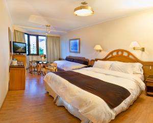 Postel nebo postele na pokoji v ubytování Hotel Cristal