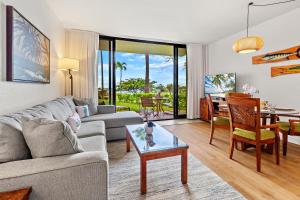 a living room with a couch and a table at Kaanapali Shores 104 in Kahana