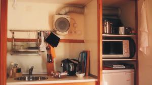 a kitchen with a sink and a microwave at Monte da Xara in Aljezur +48 photos