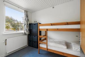 Postel nebo postele na pokoji v ubytování Cozy Brenderup Apartment on the beach