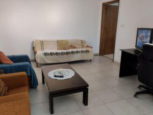 a living room with a couch and a coffee table at Embastay in Emba