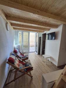 a living room with a couch and a table at Loft piano terra a 300m dal mare in Terracina
