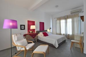 A bed or beds in a room at Aspro Villas