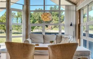 a living room with a couch and a table at Holiday Home Toftevej Løkken V in Løkken