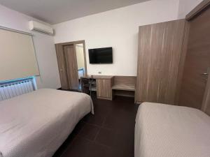 Voodi või voodid majutusasutuse Hotel Ristorante Borgo Antico toas