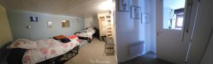 a small room with two beds and a hallway at Chambre d'Hôtes le Gachignard in Courlay +16 photos