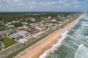 an aerial view of a beach and the ocean at Wave Runner in Flagler Beach