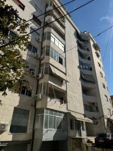 an apartment building with a lot of windows at Tirana Center Luxury Landing in Tirana