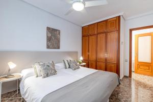 A bed or beds in a room at Fidalsa Paradise Pines