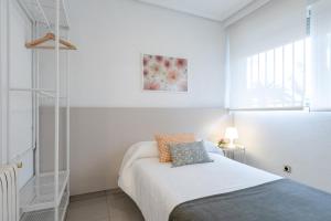 A bed or beds in a room at Fidalsa Paradise Pines