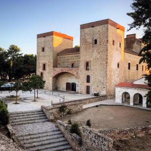 a large building with stairs in front of it at Hostal Niza in Badajoz