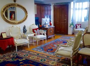 a room with chairs and a table and a mirror at Ada Hotel Istanbul in Istanbul
