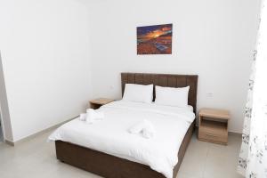 Postel nebo postele na pokoji v ubytování Hotel Paradise