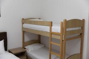 Postel nebo postele na pokoji v ubytování Hotel Paradise
