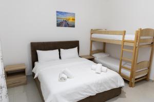 Postel nebo postele na pokoji v ubytování Hotel Paradise