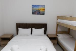 Postel nebo postele na pokoji v ubytování Hotel Paradise