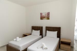 Postel nebo postele na pokoji v ubytování Hotel Paradise