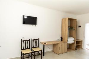 TV a/nebo společenská místnost v ubytování Hotel Paradise