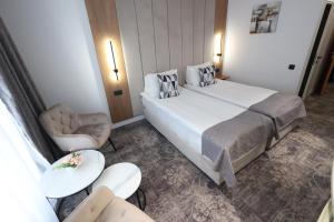 Postel nebo postele na pokoji v ubytování Hotel Soimul