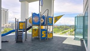 a playground in a building with a view at BaySuites Likas by Alawa Homes in Kota Kinabalu