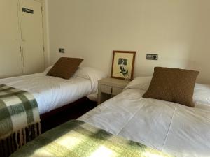 Cama o camas de una habitación en Casa do Bidueiro