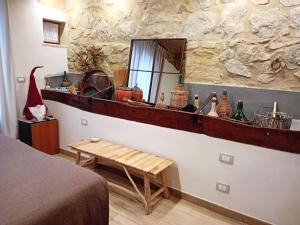 a room with a counter with a mirror and a table at Casa Maria - Dimora di Charme in Montalcino +49 photos
