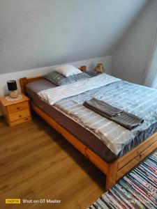 Postel nebo postele na pokoji v ubytování Domek Kutowa