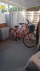 two bikes parked next to each other in a garage at La casita Libertad en San Miguel del Monte in San Miguel del Monte