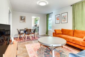 a living room with a couch and a table at Hike, Boat and Fish Dog-Friendly Robinson Home in Robinson
