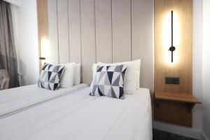 Postel nebo postele na pokoji v ubytování Hotel Soimul