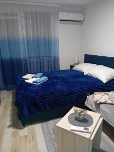 Postel nebo postele na pokoji v ubytování Apartman i Studio Nikolas