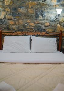 Postel nebo postele na pokoji v ubytování Ξενώνας Σκαλοπάτια