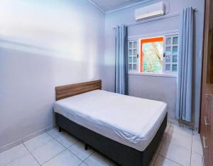 Una cama o camas en una habitación de Casa c pisc e churrasq a 100m da Praia de Maresias