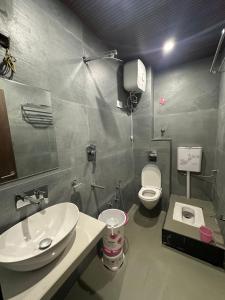 a bathroom with a sink and a toilet at HOTEL PREMIER CHOICE - JUST 50 Meters FROM AJMER SHARIF DARGAH in Ajmer