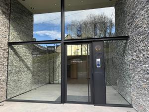 an entrance to a building with a glass door at Edificio Libertador in Ushuaia