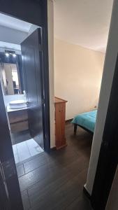 En eller flere senge i et værelse på Lindo Departamento