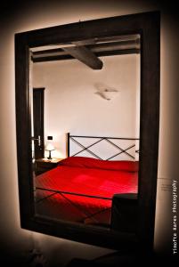Postel nebo postele na pokoji v ubytování Agriturismo Il Rustico