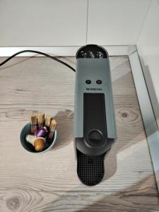 a smart phone sitting on top of a table at Studio Apartment Pulse Zagreb Knezija in Zagreb +23 photos