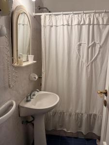 Koupelna v ubytování Hotel Ideal