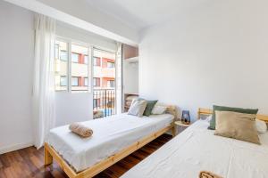 A bed or beds in a room at Apartamento del Mar
