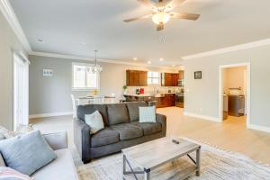 a living room with a couch and a table at 5 Mi to Shasta Lake Newly Built Home with Backyard! in Shasta Lake