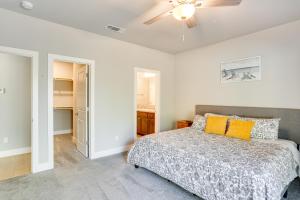 a bedroom with a bed and a ceiling fan at 5 Mi to Shasta Lake Newly Built Home with Backyard! in Shasta Lake